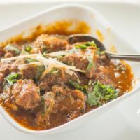 Goat Curry · tender morsels of goat cooked in its own traditional curry.