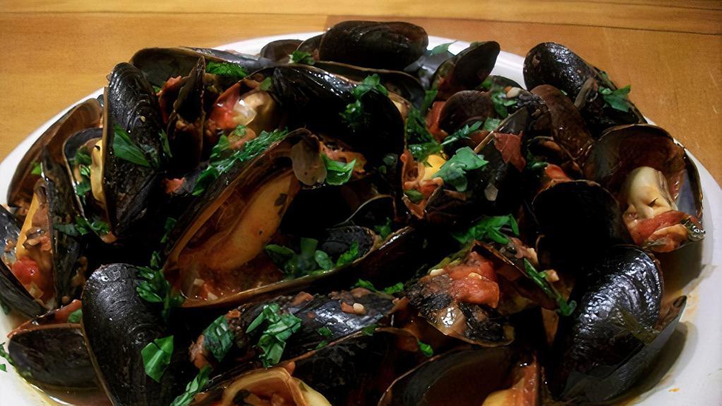 Mussels Luciano · Fresh mussels sautéed with extra virgin olive oil, garlic, and white wine.
