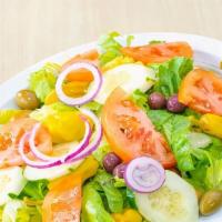 House Salad · Tomato, cucumber, Red Onions roasted peppers, Gaeta olives, and Shredded Carrots over iceber...
