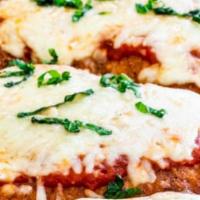 Veal Parmigiana · Breaded veal, sauce, and melted mozzarella.
