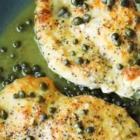 Veal Piccata · Tender pan-seared veal sautéed with capers and artichoke hearts in a light wine lemon sauce.