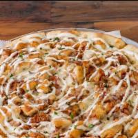 Bacon Chicken Ranch Pizza · Mozzarella cheese, maple glazed bacon, and chopped tomatoes topped with Cheddar and ranch dr...