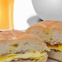 2 Eggs On A Roll · Served with choice of ham, bacon, or sausage with cheese. Includes choice of drinks.