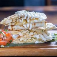 Quesadilla · Grilled flour tortillas filled with melted Monterey mustard cheese. Served with lettuce, pic...
