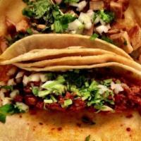 Chorizo Soft Taco · Mexican sausage. Served with a soft corn tortilla, onion, cilantro, and guacamole sauce.