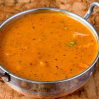 Chicken Tikka Masala · Tandoori chef classic. Boneless marinated chicken broiled in the tandoor and then smothered ...