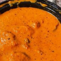 Butter Chicken · Boneless chicken served in a butter cream sauce with flavorful herbs and spices. Served with...