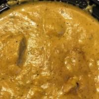 Chicken Korma · Succulent chicken pieces simmered in herbs, spices, and a rich creamy sauce. Served with bas...