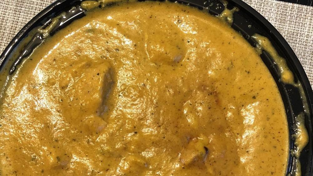 Chicken Korma · Succulent chicken pieces simmered in herbs, spices, and a rich creamy sauce. Served with basmati rice.