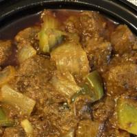 Kadhai Lamb · An aromatic lamb preparation stir-fried with tomatoes, onions and crushed spices. Served wit...