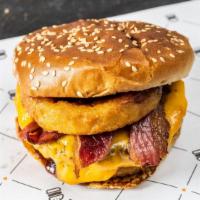 Dry-Aged Beef · 712 calories. 1/3 lb patty, barbecue, onion ring, bacon and Cheddar cheese.
