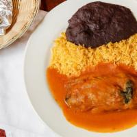 Chiles Rellenos · Cheese stuffed poblano pepper with rice, refried beans, and corn tortillas.
