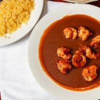 Camarones A La Diabla · Sauteed shrimp with chipotle sauce. Served with yellow rice, refried black beans, and corn t...