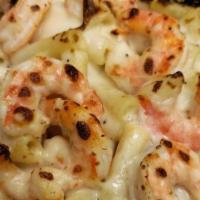 Shrimp Scampi · Large pieces of shrimp smothered in a butter, garlic and wine sauce, served with freshly squ...