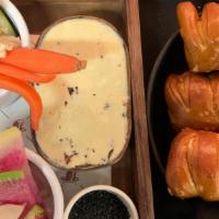 Catch Steak Bread Service · Warm Pretzel Batons, Pickled Radishes, Local Assorted Butter