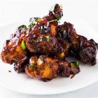 Chipotle Bbq Wings · Charr grilled wings cooked with chipotle bbq sauce.