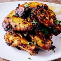 Zaitun Original Wings · Charred wings with chef special spices.