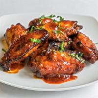 Bbq Buffalo Wings · Charr grilled wings cooked with buttery buffalo sauce.