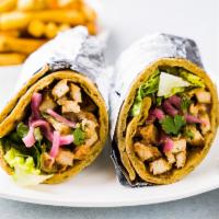 Chicken Shawarma Wrap · Yogurt and spice marinated chicken breast, green mix, pickled onion, and white sauce.
