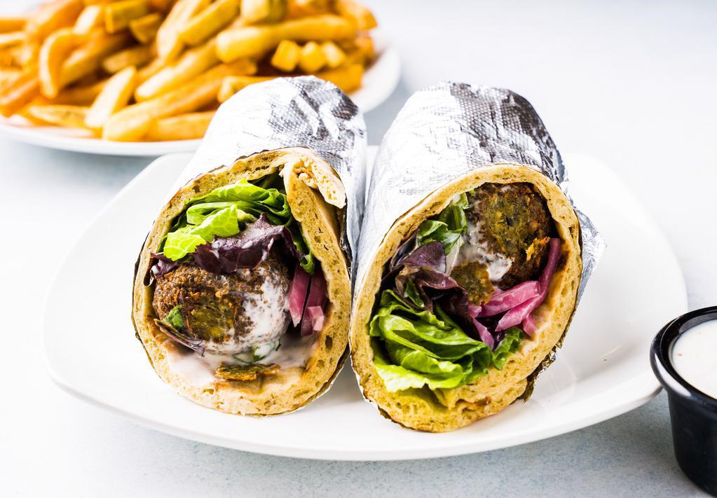 Falafel Hummus Wrap · Falafel, green mix, hummus, pickled onions, and white sauce.