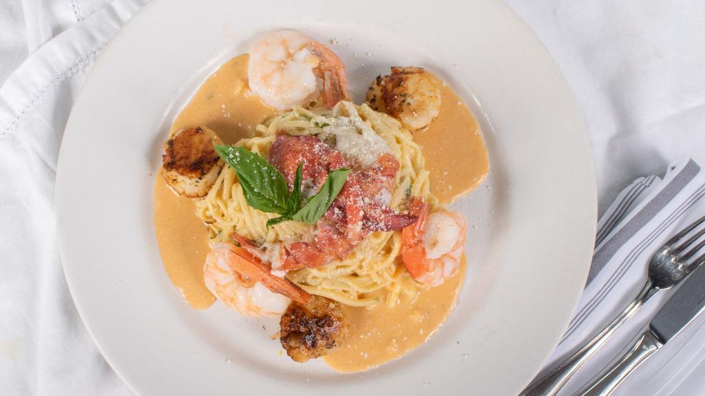 Seafood Spaghetti · Shrimp, scallop and lobster, garlic, fresh herbs, white wine.