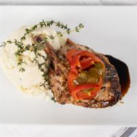 Wood-Fired Pork Chop · Double cut pork chop with cherry peppers and garlic-rosemary mashed potato.