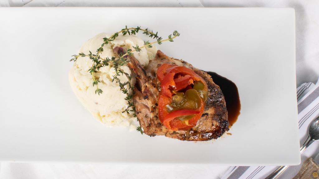 Wood-Fired Pork Chop · Double cut pork chop with cherry peppers and garlic-rosemary mashed potato.
