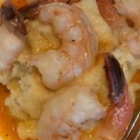 Jumbo Shrimp Scampi · Pan sautéed jumbo shrimp with garlic butter, white wine and parsley over angel hair pasta.