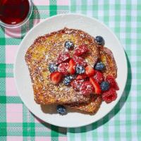 Le Berry Blast French Toast · Put on your berets, because this dish is “berry” good! Classic French toast topped with an a...