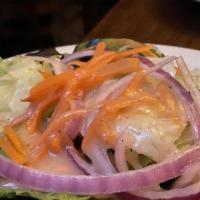 Mixed Green Salad · Mixed field greens, tomato, onion and house dressing.