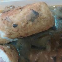 Chicken Rollatini · Breast of chicken filled with prosciutto and mozzarella, sautéed in Marsala and mushroom sau...