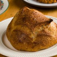 New York Sourdough · Mild sourdough loaf with a substantial crust and a chewy, open interior. New York State flou...