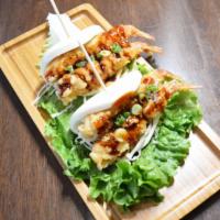 Shrimp Tempura Bun 2 Pieces · Shrimp tempura sandwiched in cabbage, green onion, special sauce and steamed soft bun.