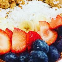 Acai Bowl · Acai puree, granola,  bananas, strawberries, blueberries, and shredded coconut.