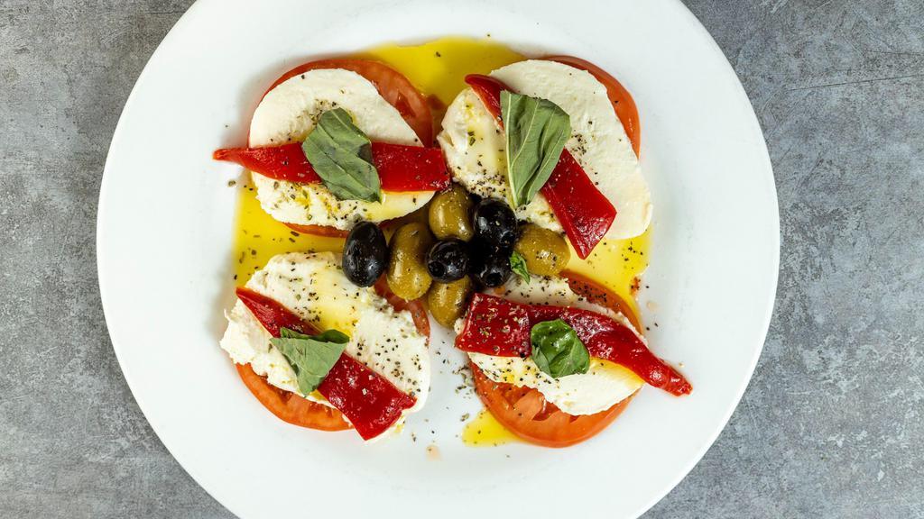 Fresh Mozzarella With Tomato Salad · Mozarella, tomato, roasted red peppers, and olives.