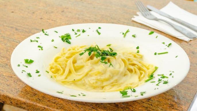 Fettuccine Alfredo · Pasta served in a white cream sauce.