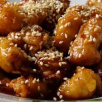 Sesame Chicken · Served with egg roll and pork fried rice.