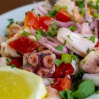 Seafood Salad · Gluten free. Octopus, shrimp and calamari with celery, red peppers, garlic, fresh parsley, E...