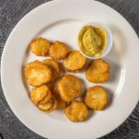 Pickle Chips · Fried pickles served with honey mustard