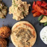 Hummus & Pita Platter · Serves 6 people. Requires 24 hrs notice. Hummus, olive oil and toasted pita.