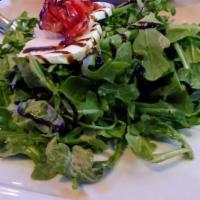 Veal Milanese · Thinly Pounded Bone-in Veal, Breaded & Fried Crisp. Topped with Arugula Salad, Roasted Peppe...