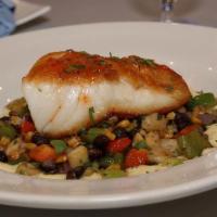 Chilean Sea Bass · Pan-Seared Sea Bass Served Over Corn, Black Beans, Peppers, Celery, Pineapple & Corn Coulis ...
