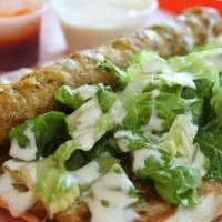 14-K. Kebob Roll · On naan bread. Chicken kebob and salad in a naan bread.