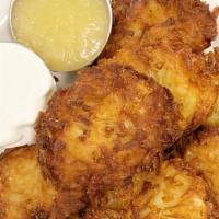 Joyce'S Famous Potato Latkes · Grandma Joyce Famous Potato Latke w/ Sour Cream and Applesauce.