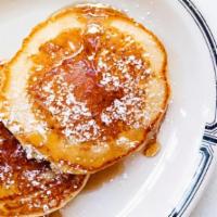 Short Stack Of Pancakes · Homestyle Pancakes with Butter and Syrup.