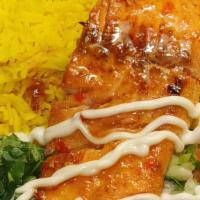 Honey Glazed Salmon Over Rice · Honey Glazed Salmon over rice or mixed with lettuce and a Mediterranean salad.