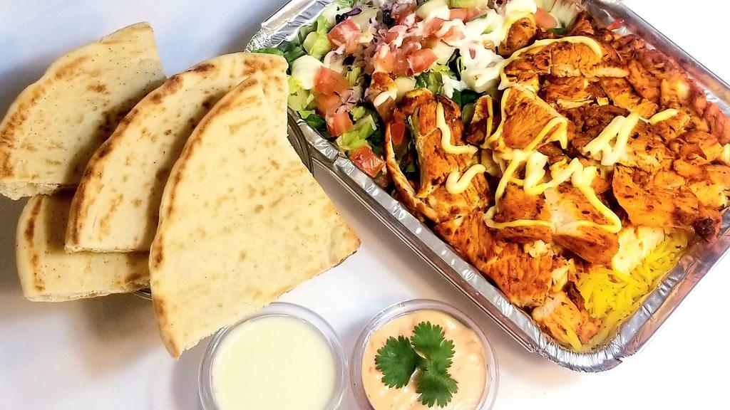 Grilled Chicken  Over Rice  · Grilled chicken over rice or mixed with lettuce and a Mediterranean salad. Served with pita and soda.