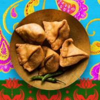 Vegetable Samosa · Filled with potato and peas.
