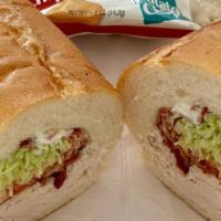 Turkey Club · Turkey with Crispy Bacon, Lettuce, Tomato, Onion, Salt, Pepper, Mayo.