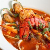 Mariscada En Salsa Roja · Perfect for seafood lovers !! Delicious blend of seafood, and fish. Prepared in a unique tom...